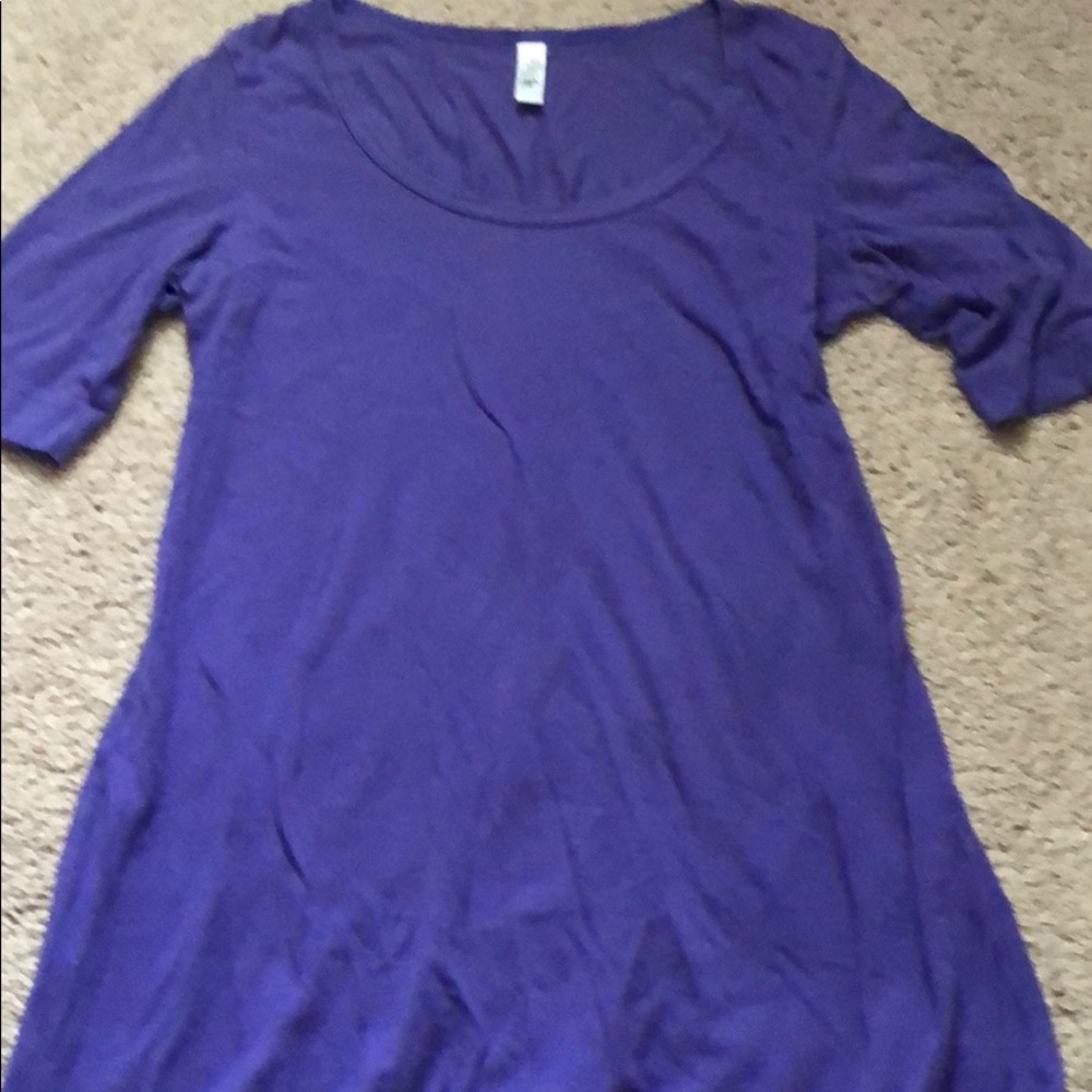 Quarter sleeve tunic length purple shirt.